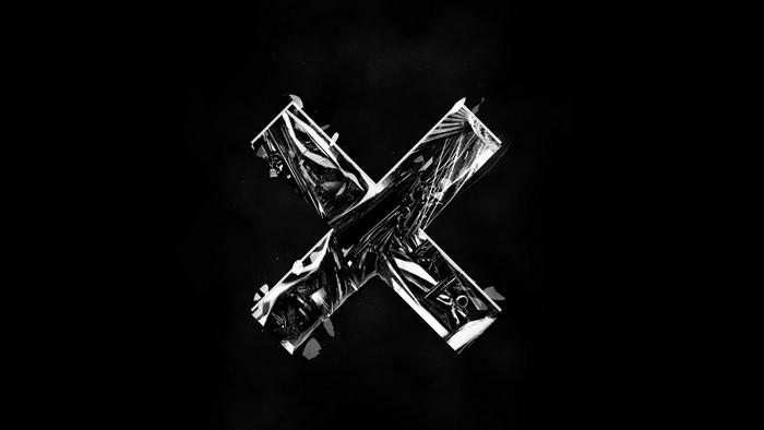 Black and white abstract 'X' symbol
