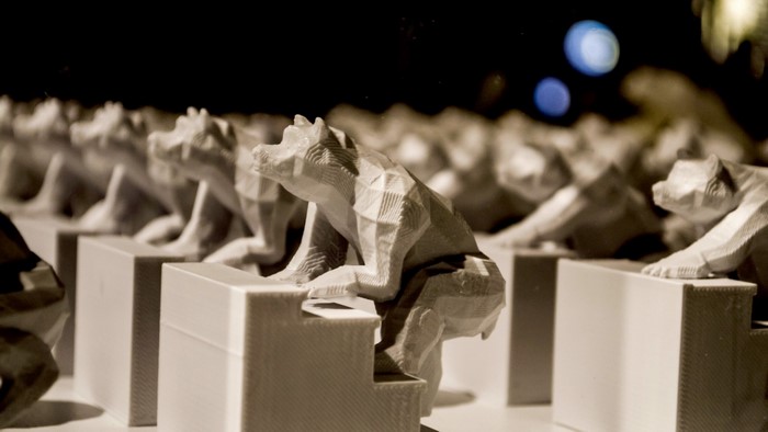 Row of 3D printed bear sculptures on stairs