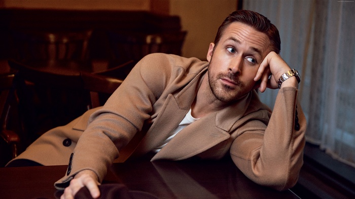 Ryan Gosling wearing a tan coat