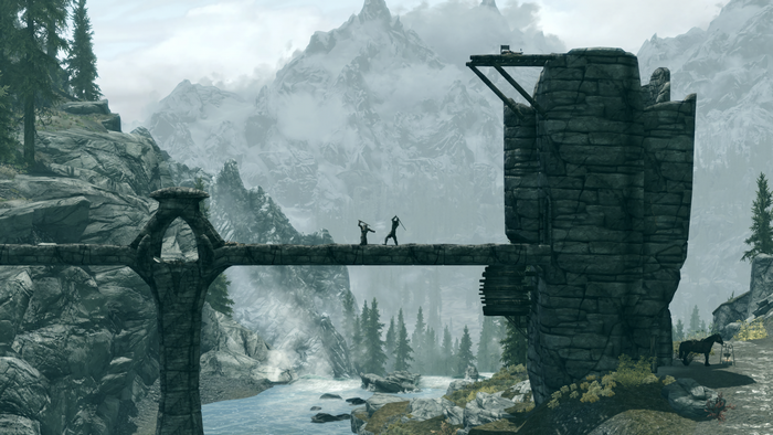 Two warriors fighting on a bridge in The Elder Scrolls V Skyrim