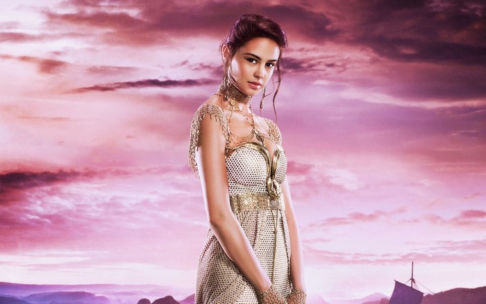 Model in a golden dress from Gods of Egypt