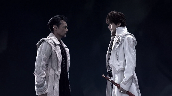 Two men in ornate coats facing each other
