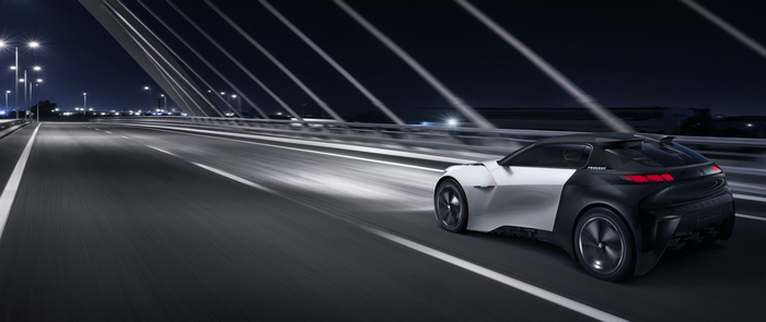 Peugeot Fractal concept car driving on a bridge at night