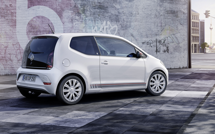 White Volkswagen Up! parked on a city street