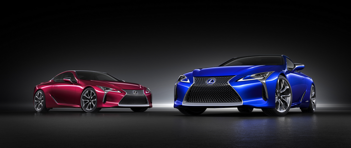 Two Lexus LC 500 sports cars, one red and one blue