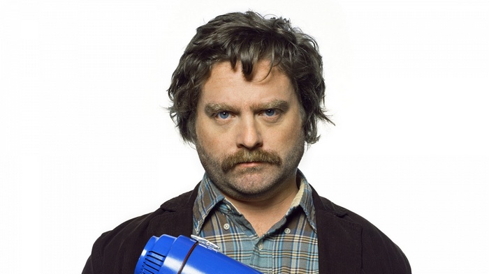 Zach Galifianakis holding a blue object