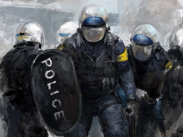 Police officers in riot gear with shields