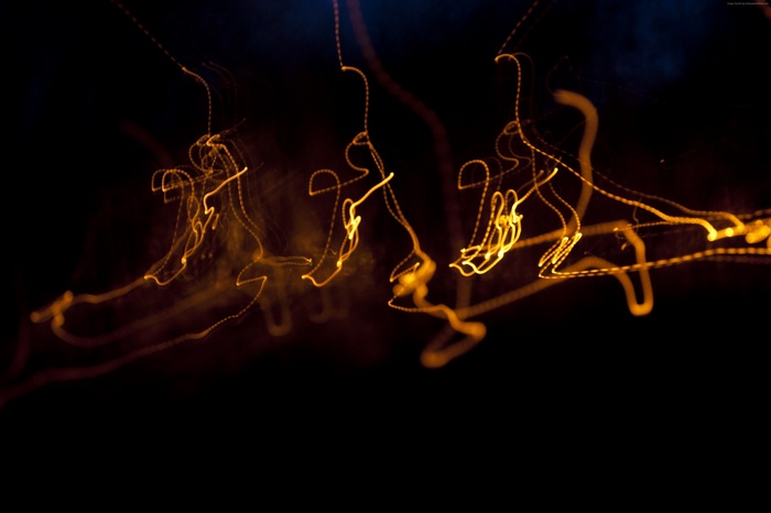 Yellow light trails on black background