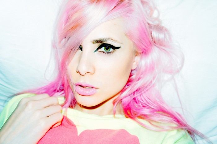 Woman with pink dyed hair and green eyes