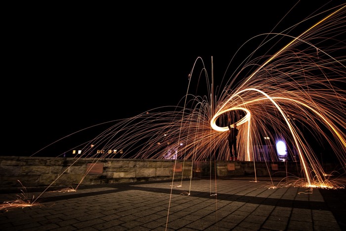 Long exposure light painting with steel wool at night