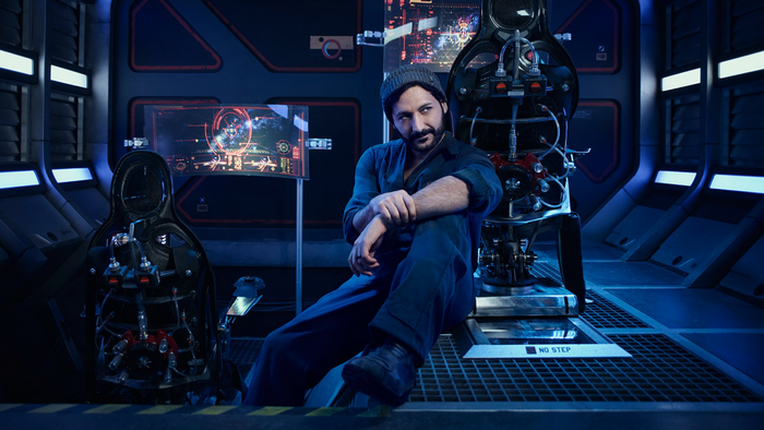 Alex Kamal from The Expanse in a spaceship cockpit