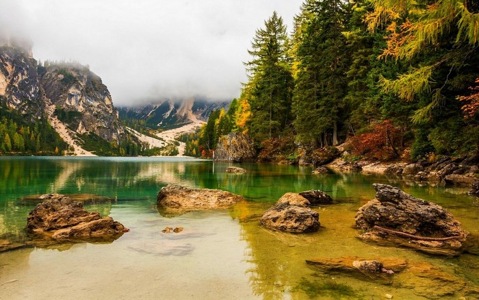 Autumnal lake with mountains and forest