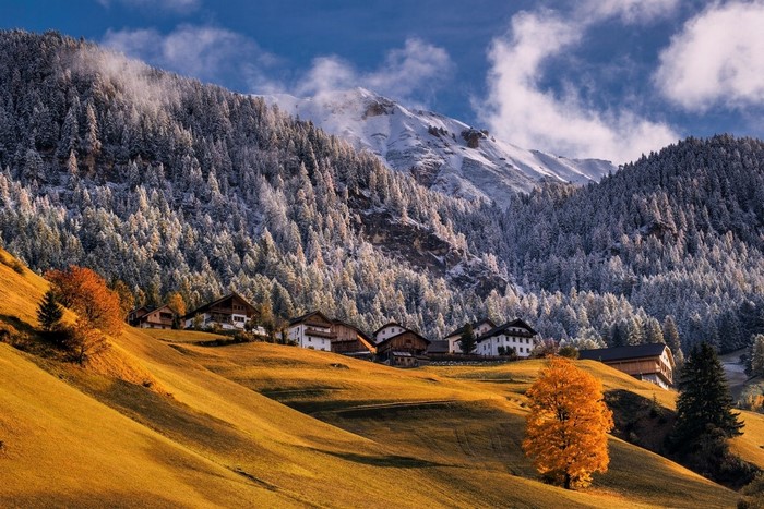 Sunlit Autumn Village in the Italian Alps
