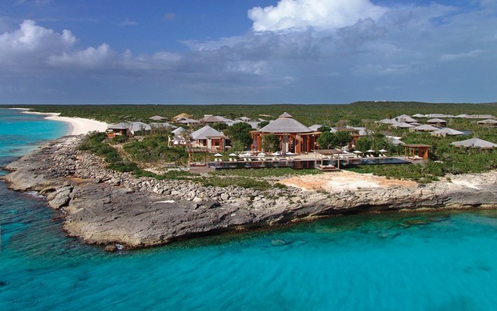 Tropical resort on a rocky coastline with turquoise water