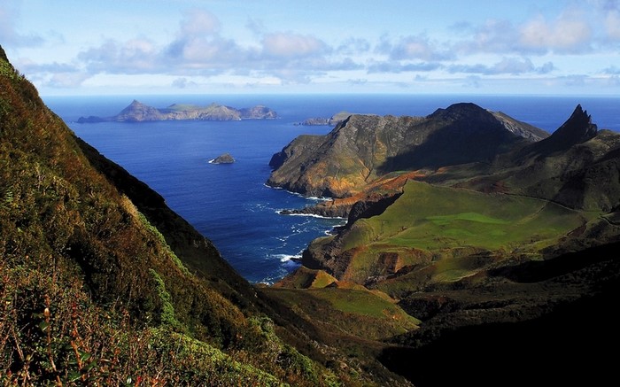 Rugged coastal mountains meeting the blue ocean
