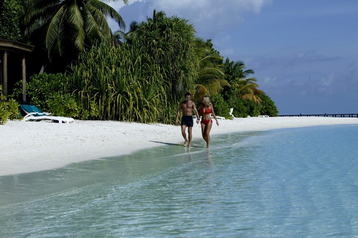 Couple walking on a tropical beach