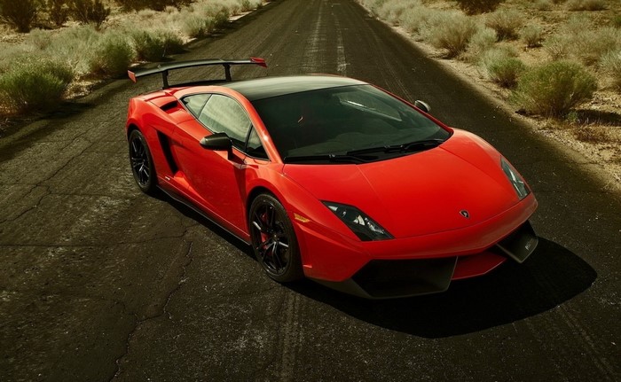 Red Lamborghini Gallardo on a Desert Road