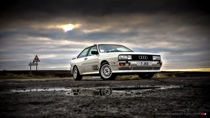 White Audi Quattro on a cloudy day