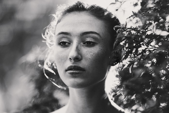Monochrome portrait of a woman with freckles