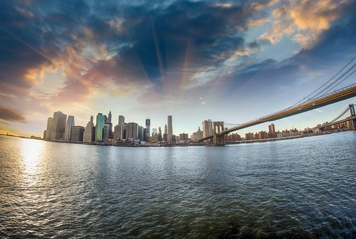 New York City skyline and Brooklyn Bridge at sunset