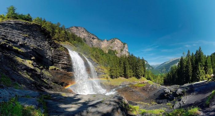 Waterfall with Rainbow in the Alps