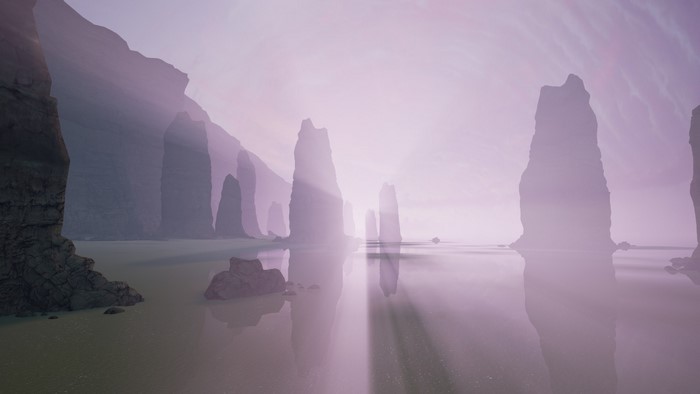 Misty coastal landscape with rock formations at sunrise