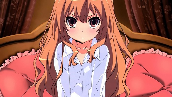 Aisaka Taiga from Toradora sitting on a bed
