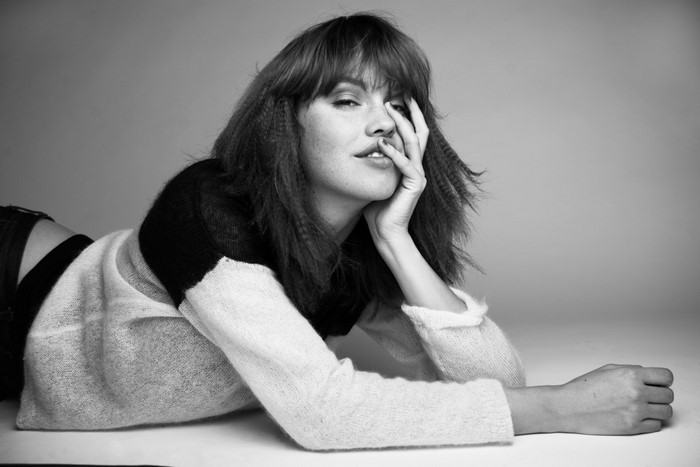 Julia Johansen lying down, hand on face