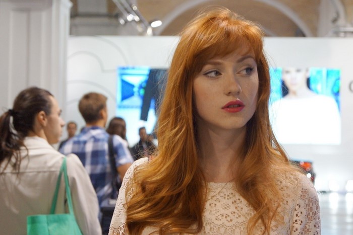 Woman with red hair and red lipstick