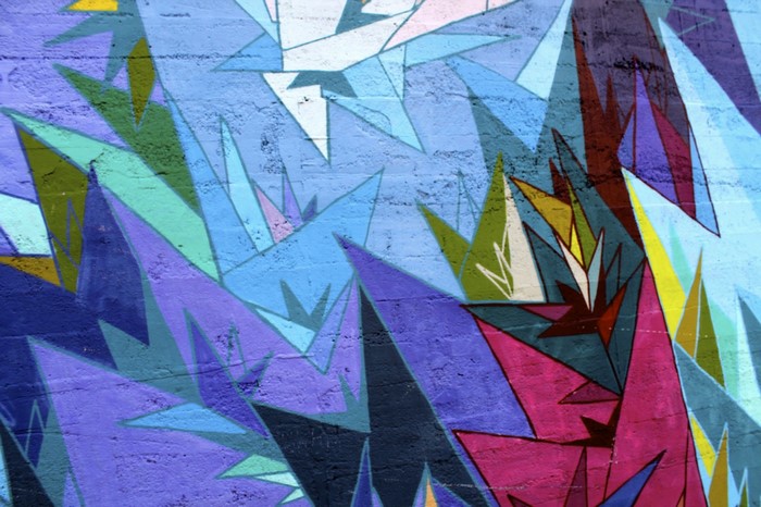 Abstract geometric mural with sharp angles and vibrant colors