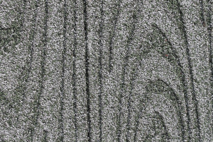 Close-up of textured asphalt with vertical lines