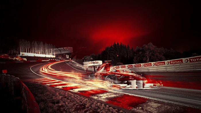 Ferrari Formula 1 car on a race track at night