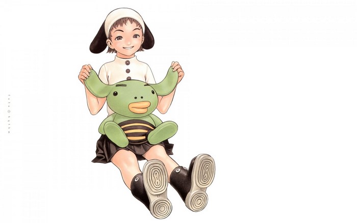 Girl holding a green toy creature