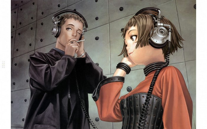 Two people with headphones listening to music