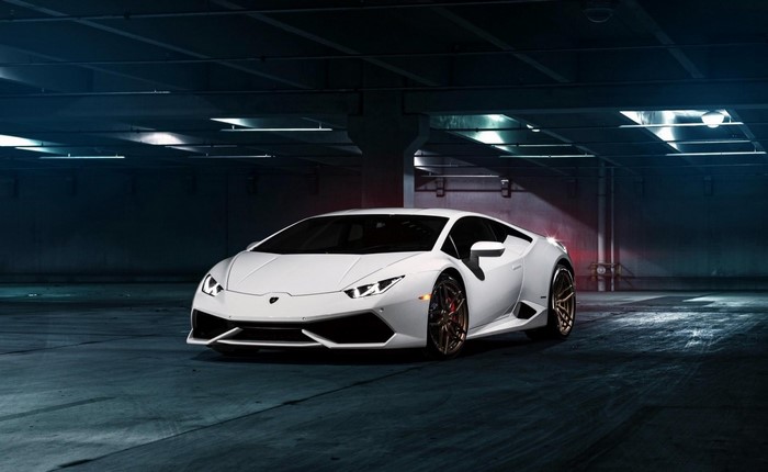 White Lamborghini Huracan parked in a dark garage