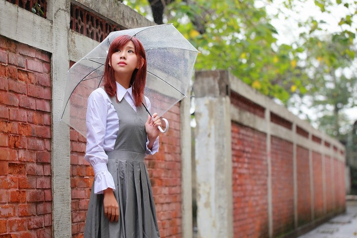 Asian woman holding an umbrella