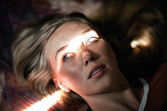 Woman with sunlight on her face
