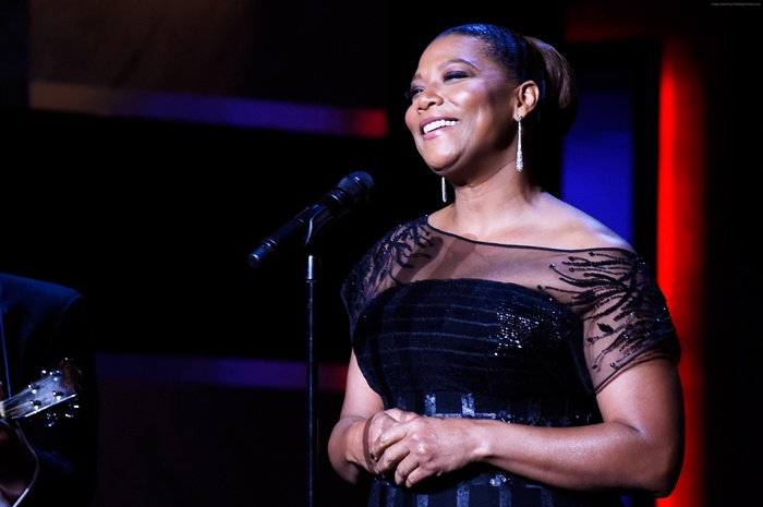 Queen Latifah performing on stage