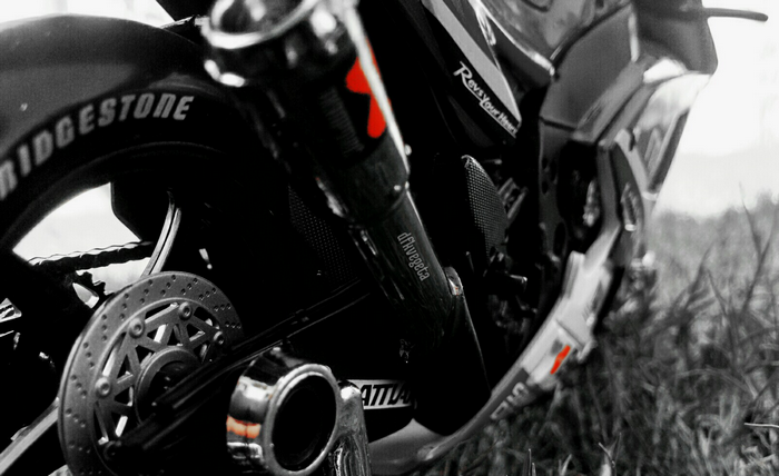 Motorcycle with Bridgestone tire and Akrapovič exhaust
