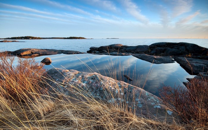Rocky coast with a calm sea and reflection