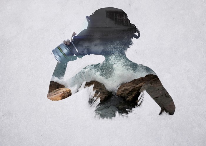 Double exposure of woman in gas mask and ocean waves