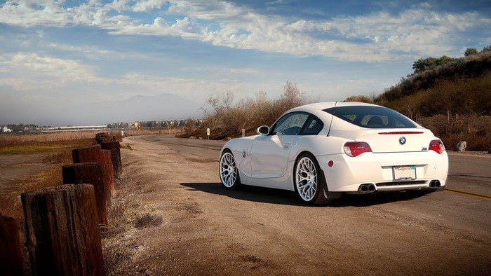 White BMW Z4 Coupe on a Winding Road