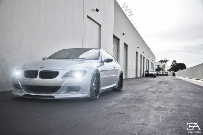 Silver BMW M6 Coupe parked outside a warehouse