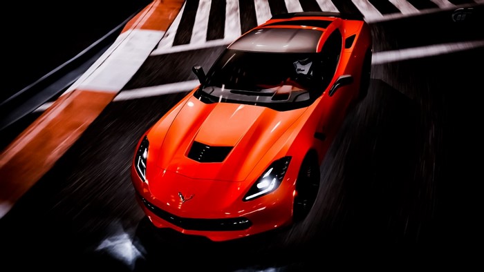 Orange Chevrolet Corvette Stingray on a race track