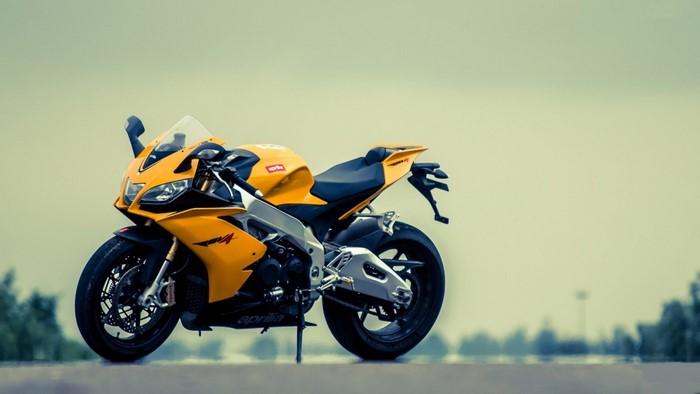 Yellow Aprilia RSV4 Motorcycle on Road