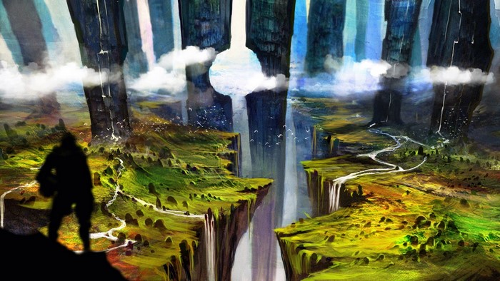 Silhouette of a person overlooking a vast canyon with waterfalls