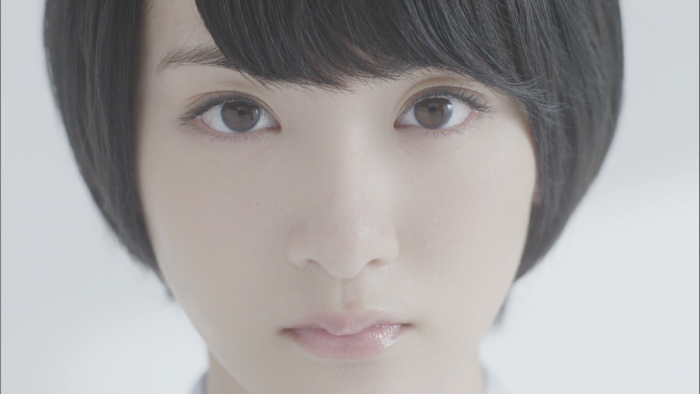 Asian woman with short black hair and brown eyes