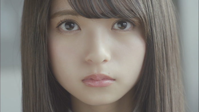 Close up of a young Asian woman with brown hair