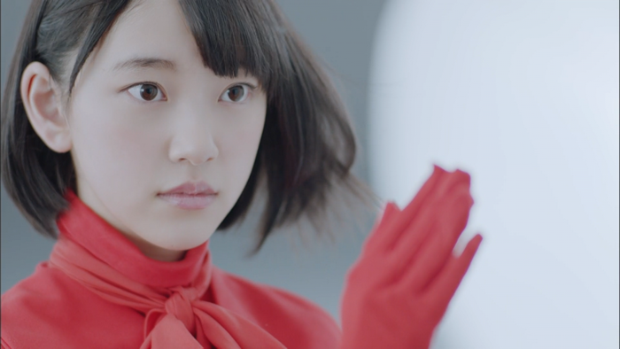 Girl in red top and gloves