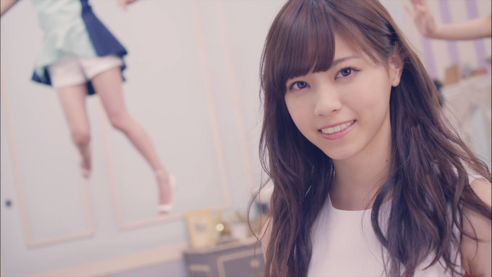 Woman with long brown hair smiling